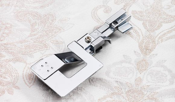Gathering foot for coverstitch on decorative fabric - Husqvarna Viking sewing accessory