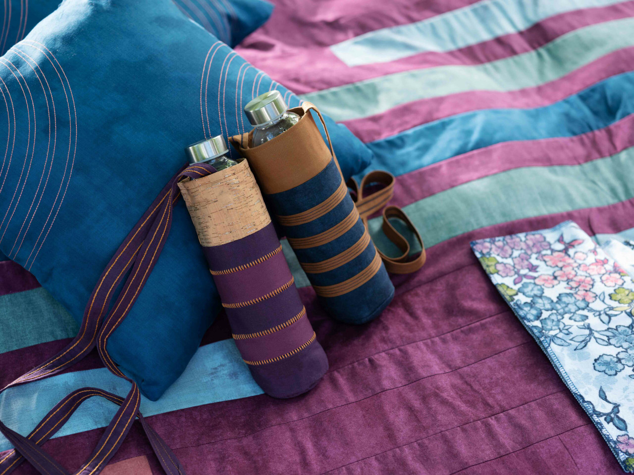 Quilted fabric rolls striped wrapping blue magenta handmade sewing project cosy style