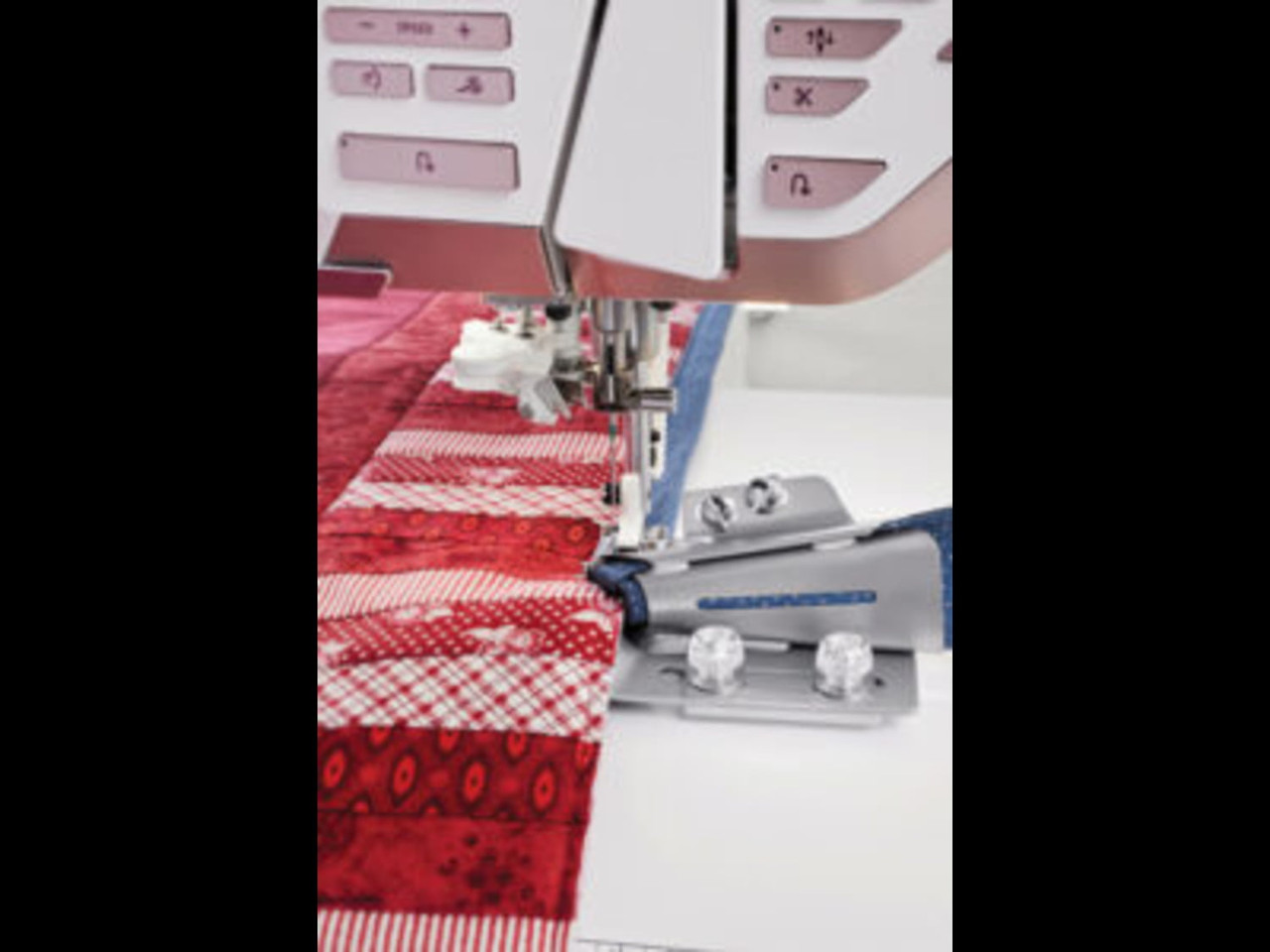Husqvarna Viking Quilt Binder – Front view showing quilting accessory for binding quilts.