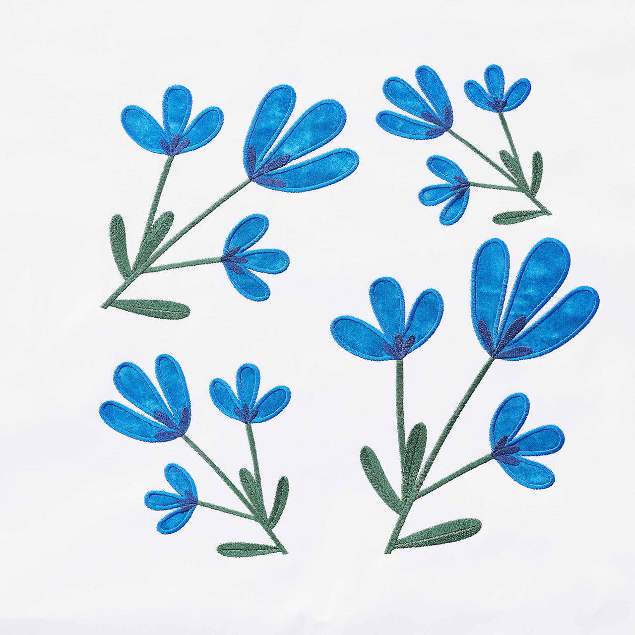 Blue floral embroidery pattern on white fabric for Lisarow sewing machines.