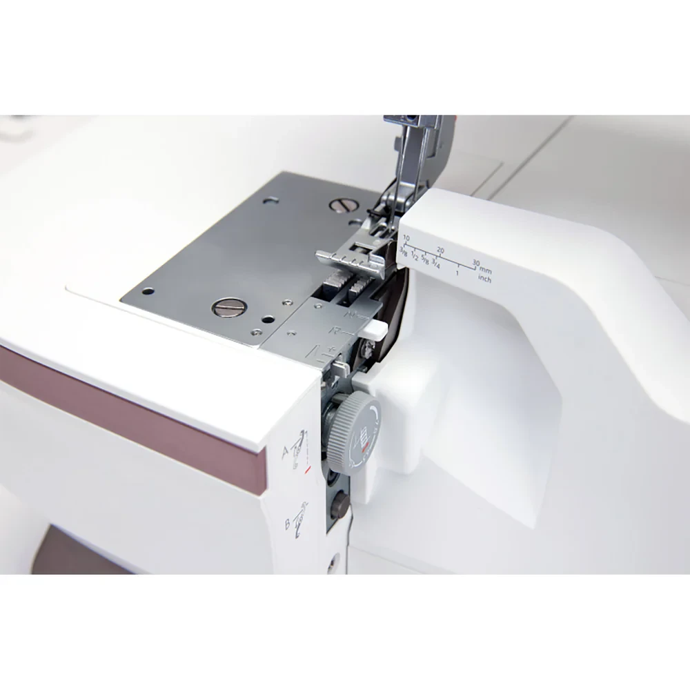 Close-up view of modern sewing machine showing detailed stitching mechanisms.