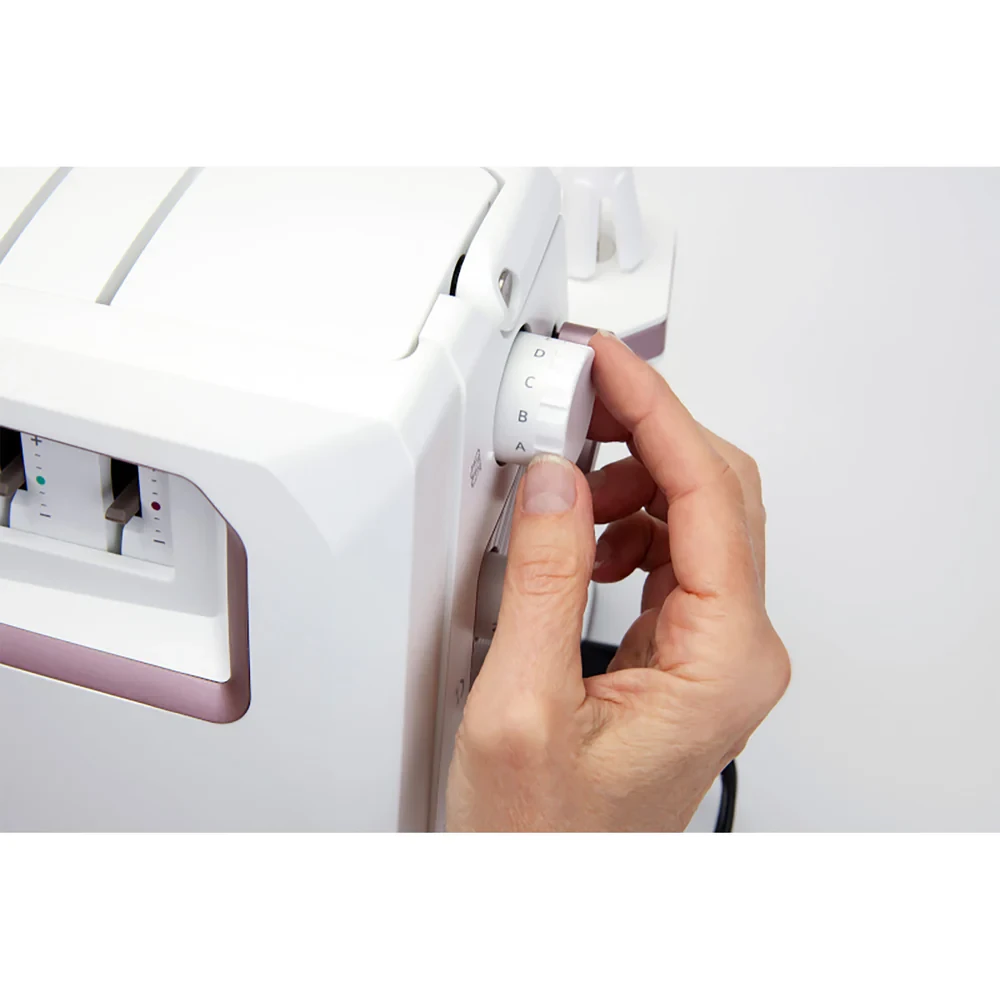 Adjusting settings on a white sewing machine for precise stitching.