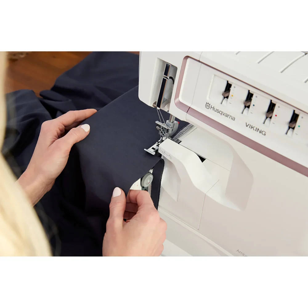 Person sewing fabric with a white sewing machine in Lisarow NSW.