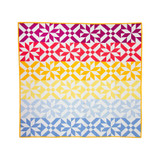 Colorful geometric quilt showcasing precision fabric cutting techniques.