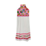 Colorful textile panel with vibrant patterns over a white pleated fabric base.
