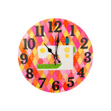 Colorful clock with a sewing machine graphic on a patterned fabric background.
