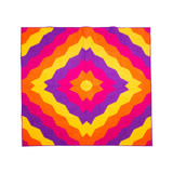 Colorful geometric quilt with vibrant orange pink yellow and purple patterns.