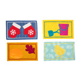Colorful fabric samples with various playful designs and shapes.