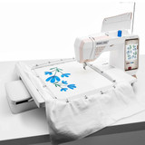 Advanced sewing machine crafting intricate floral embroidery design.