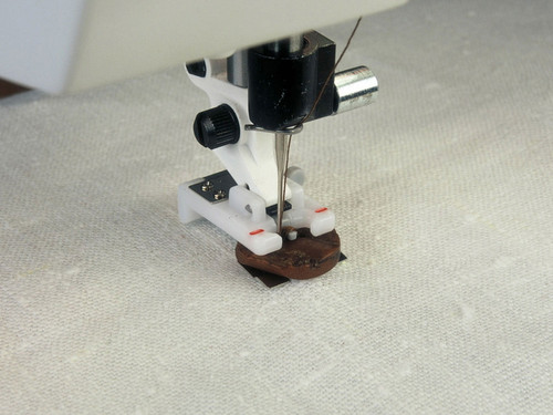 Button foot sewing accessory attaching button to fabric - Husqvarna Viking