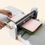 GO! Fabric Cutter Starter Set (AQ55100S) - GO! Fabric Cutter Shown with a fabric cutting die and cutting mat being rolled through the cutter.