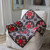 A vibrant star-patterned quilt draped over a white armchair in a cozy room.