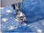 Bottom of sewing machine showing stitch‑in‑ditch presser foot on a plain background