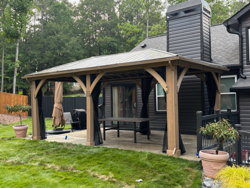 Domi Outdoor Living Hardtop Gazebo Wood-Looking with Drainage Gutters installed by a HandyBuddy expert in Newnan, GA · Jun 2026