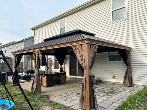 Domi Outdoor Living Hardtop Gazebo Wood-Looking with Drainage Gutters installed by a HandyBuddy expert in New Haven, IN · Jun 2024