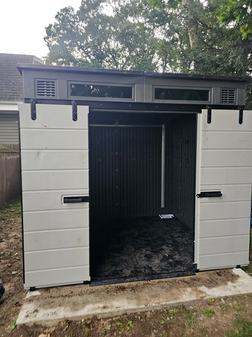 Suncast Modernist® 8x7 Dual Barn Door Storage Shed assembled by a HandyBuddy expert in Isip, NY · Jul 2026