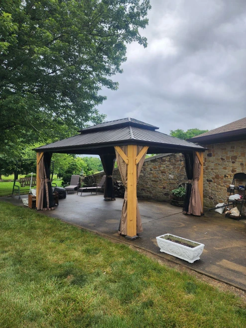 Domi Outdoor Living Wood Gazebo with Steel Roof - Cedar Post installed by a HandyBuddy expert in Franklin, IN · May 2024