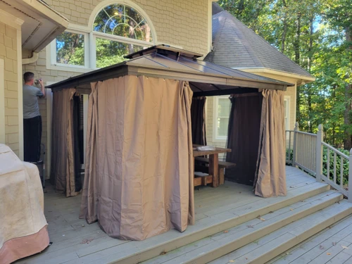 Domi Outdoor Living Polycarbonate Hardtop Gazebo Wood-looking installed by a HandyBuddy expert in Mooresville, NC · Oct 2023