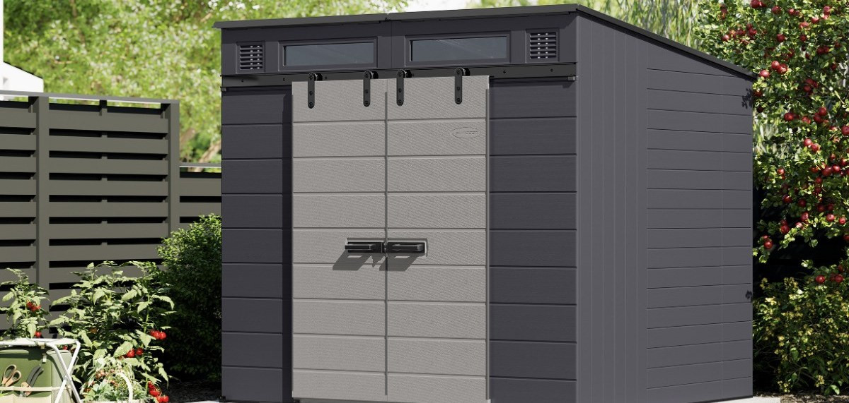 Suncast Modernist storage shed in a landscaped backyard, wide view