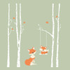 Orange mom and baby fox wall decals with white birch trees and swing shown on a soft green nursery wall
