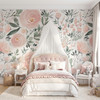 Olivia Rose Watercolor Wallpaper styled in a girls bedroom with canopy bed, pink tufted headboard, white bedding, and large blush rose wall mural