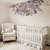 Wild Spring Garden floral wall decal with soft pink purple and blue flowers above a white crib and nursery rocking chair
