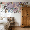 Wild Spring Garden watercolor floral wall decal border with pink lavender and blue flowers above a bed beside a tall vintage wood armoire