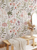 Willa large watercolor wildflower wallpaper in a romantic bedroom with neutral bedding, shown in the 52-inch repeat