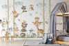 Neutral birch trees and woodland animal wall decals displayed in a bright playroom with a grey canopy bed