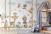 Taupe birch trees and watercolor woodland animal wall decals displayed beside a grey children’s canopy bed