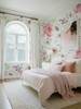 Romantic floral wallpaper in a feminine bedroom with blush bedding and arched window