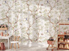 Nursery wallpaper with chinoiserie branches, birds, and blossoms styled in a bright playroom