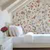 Attic bedroom decorated with Beatrice Wildflower Wallpaper and delicate watercolor flowers
