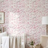 Close Up of Lauren Pink Watercolor Cherry Blossom Wallpaper in Soft Nursery Interior