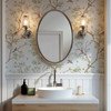 Close-up of Selina Chinoiserie wallpaper with delicate botanical branches, flowers, and soft green leaves beside a classic bathroom towel hook 52 repeat