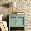 Kelsey Chinoiserie Bird Wallpaper in Bedroom With Sage Green Nightstand