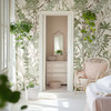 Neutral green botanical wallpaper framing a bright bedroom doorway and dressing area