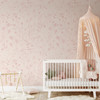 Pink wildflower floral wallpaper with delicate blush floral linework on a warm beige background for nursery bedroom bathroom and romantic cottage interiors