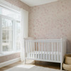 Pink wildflower floral wallpaper with delicate blush floral linework on a warm beige background for nursery bedroom bathroom and romantic cottage interiors