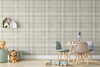 Neutral beige plaid wallpaper in 52 inch repeat styled in a kids room with play table, chairs, toys, and soft nursery decor
