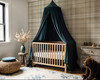 Neutral beige plaid wallpaper in 52 inch repeat styled in a nursery with wood crib, dark blue canopy, rustic dresser, teddy bear, and woven decor