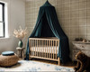 Neutral beige plaid wallpaper in 26 inch repeat styled in a nursery with wood crib, dark blue canopy, rustic dresser, teddy bear, and woven decor