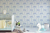 Light blue nursery wallpaper with ribbon bows on cream background