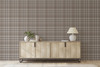 Fall Neutral brown tartan wallpaper in 52 inch repeat styled in a living room with light wood cabinet, white lamp, plant decor, and warm neutral farmhouse style