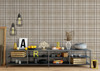 Fall Neutral brown tartan wallpaper in 13 inch repeat styled in a playroom with industrial shelves, hanging lights, toy storage, and neutral kids room decor