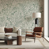 Mid-century modern living room featuring Rosemary Botanical Wallpaper with sage green botanical herbarium design.