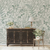 Rustic console table styled with Rosemary Botanical Wallpaper featuring delicate sage green ferns and wildflowers.