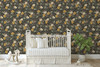 Dark daisy floral wallpaper behind a nursery crib at the 52-inch repeat