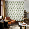 Weathered Green Cowboy Wallpaper styled in a rustic living room with leather chair, round coffee table, wood window trim, plants, and vintage Western wall decor