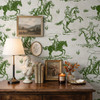 Weathered Green Cowboy Wallpaper styled with rustic wood dresser, table lamp, framed art, candles, books, and weathered green rodeo wall pattern